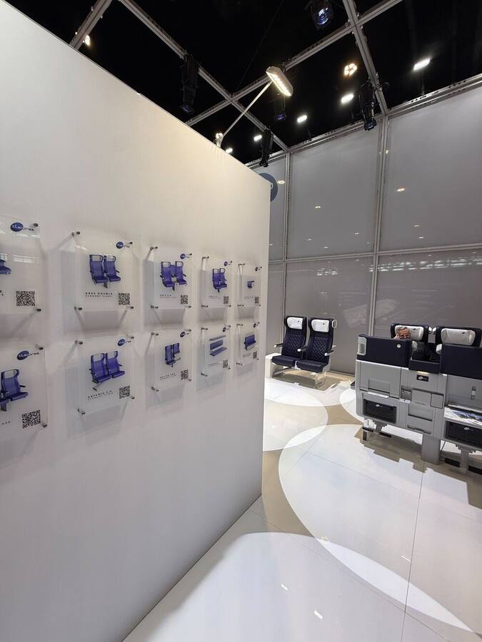 Wall with Clerprem product cards and QR codes, APTA 2026 booth